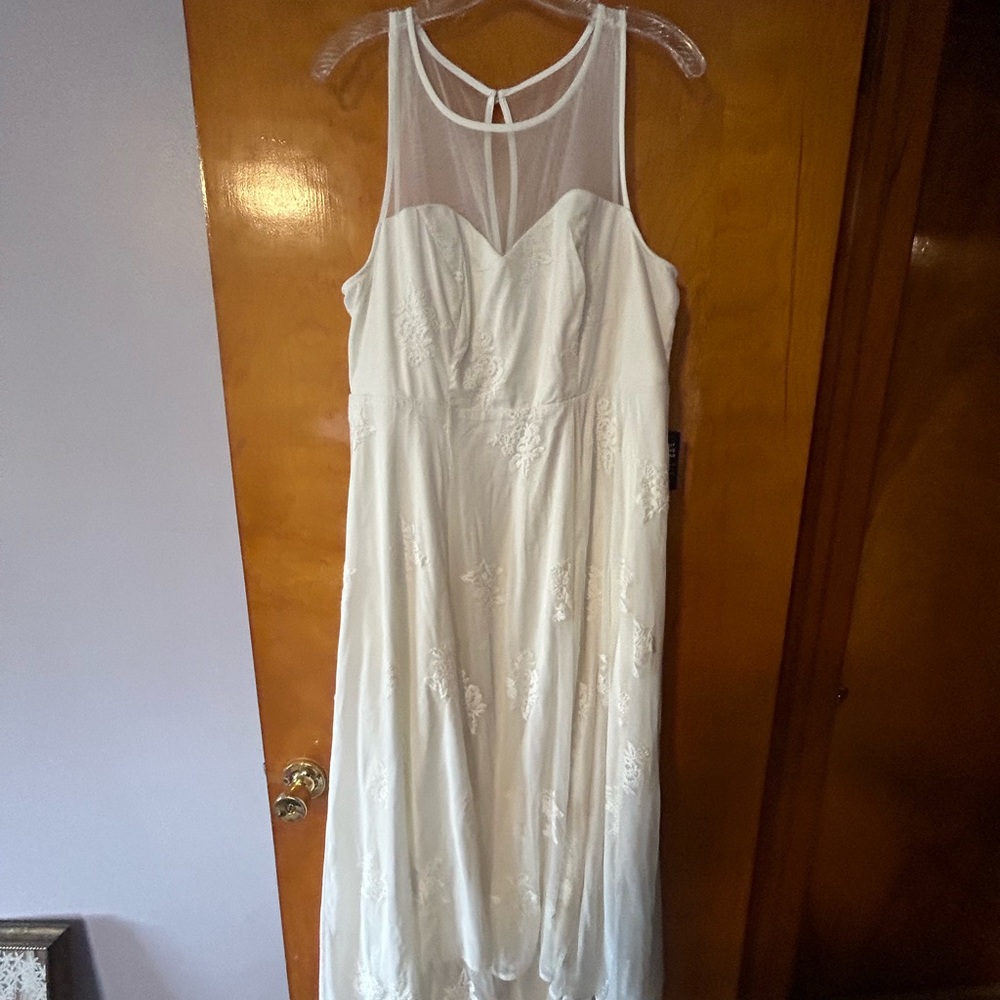 White lace dress with sweetheart neckline